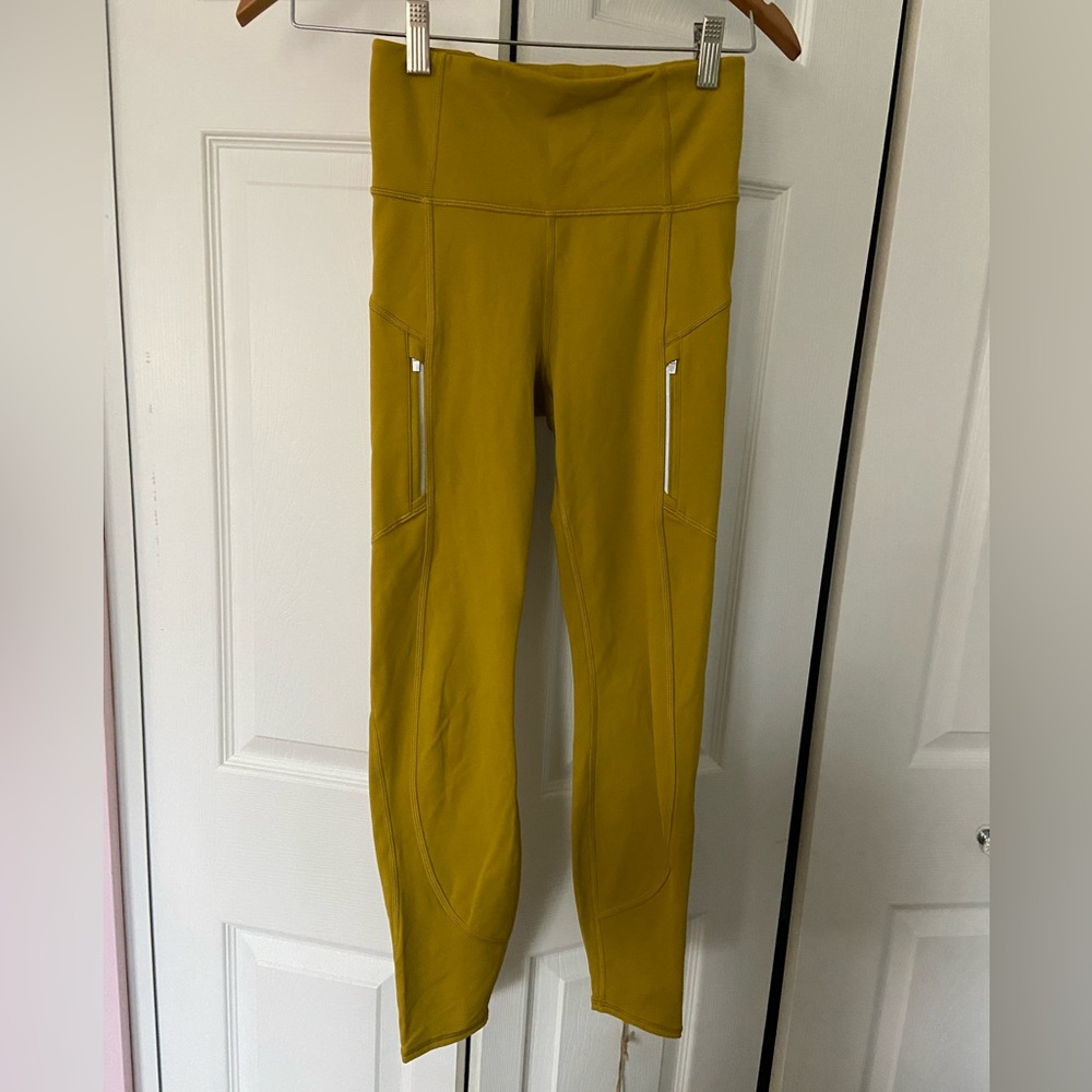 Athleta mustard yellow leggings with pockets